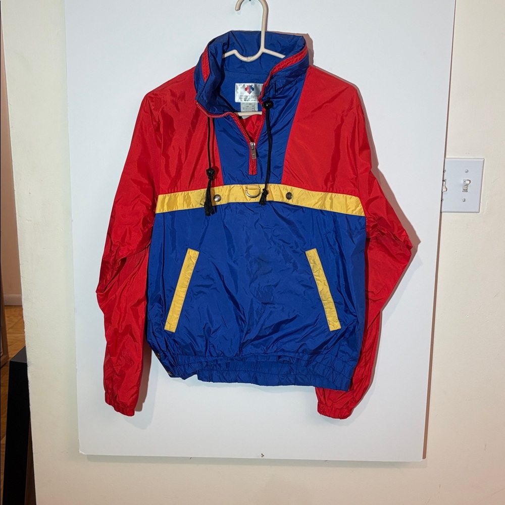 Descente Windbreaker Red and Blue with yellow accents.